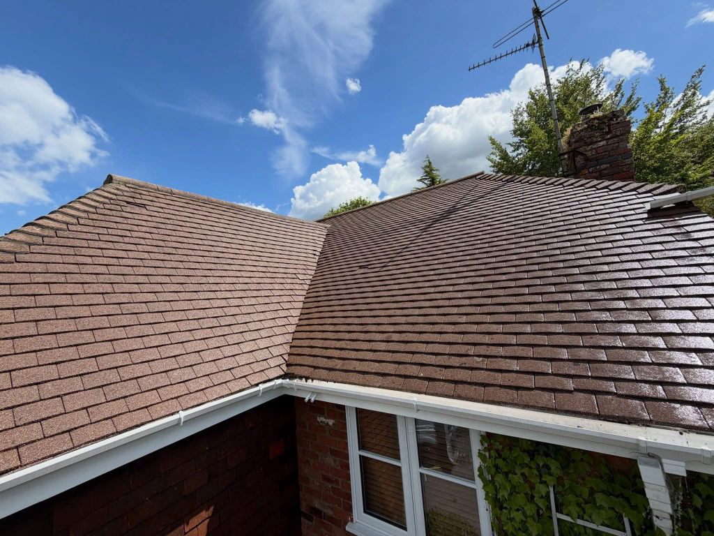 Close-up of freshly painted premium tile roof in Brisbane under clear sky